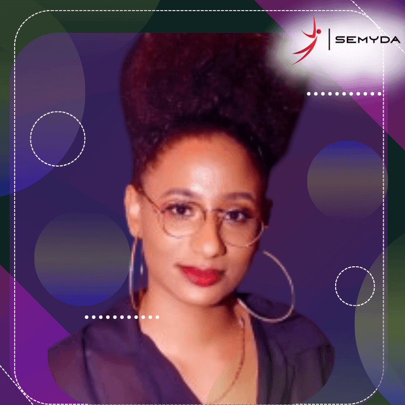 Portrait of a person with glasses and hoop earrings against a purple background with geometric patterns.